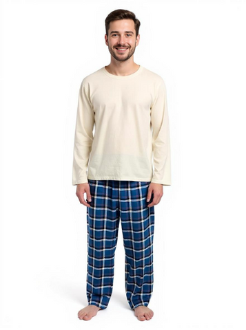 Man wearing a cream long-sleeve top and blue plaid pants on a white background